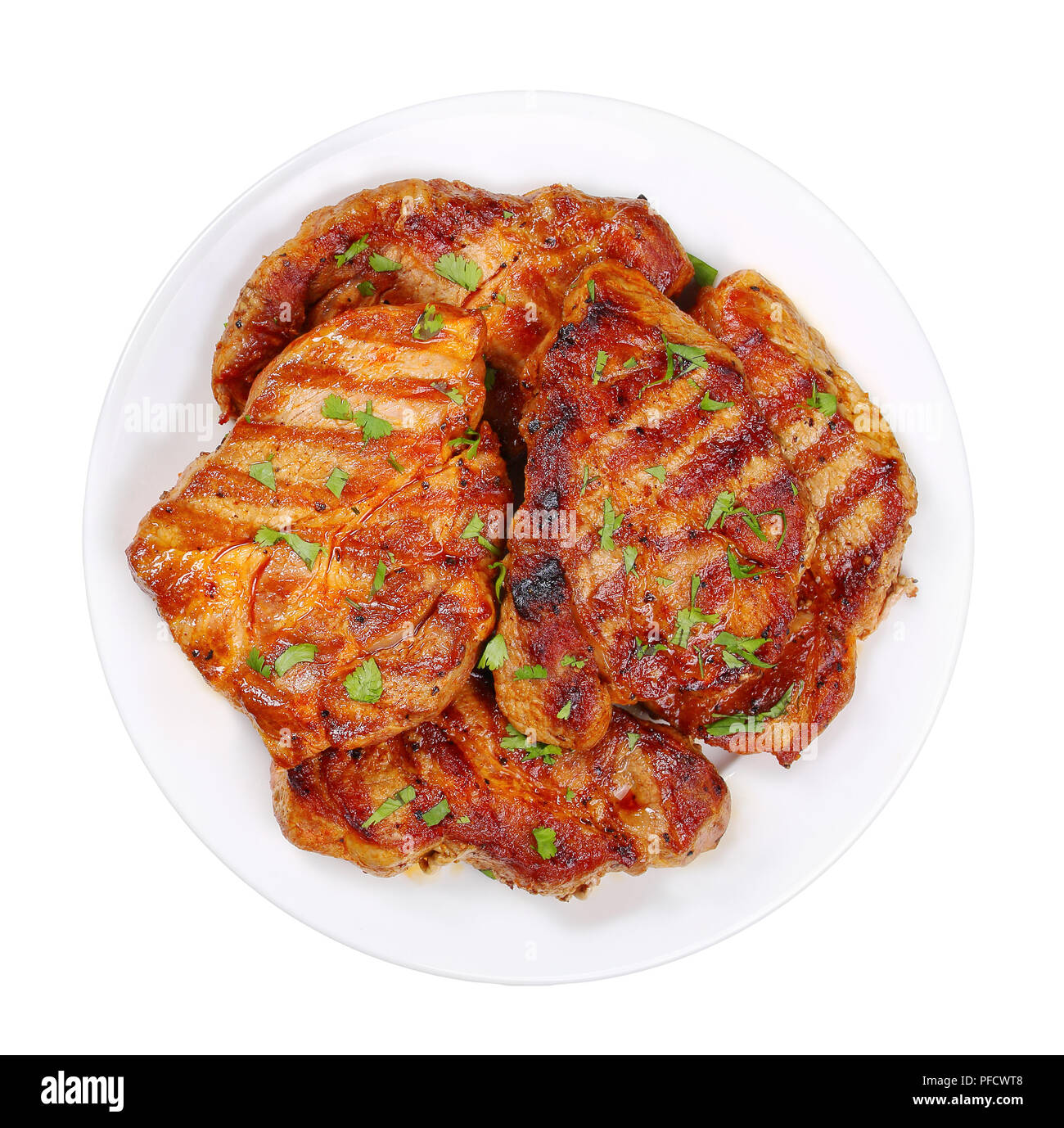 Incredibly juicy pork chops marinated in a honey, soy sauce and spices mixture, and grilled to a