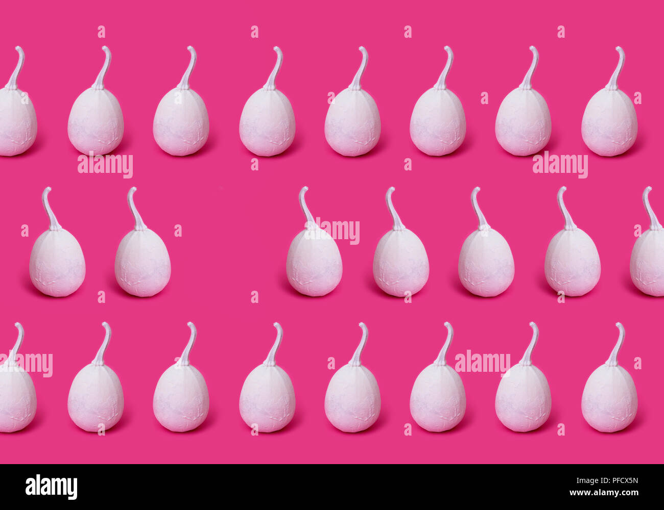 Collage with white painted pumpkins on a pink background Stock Photo