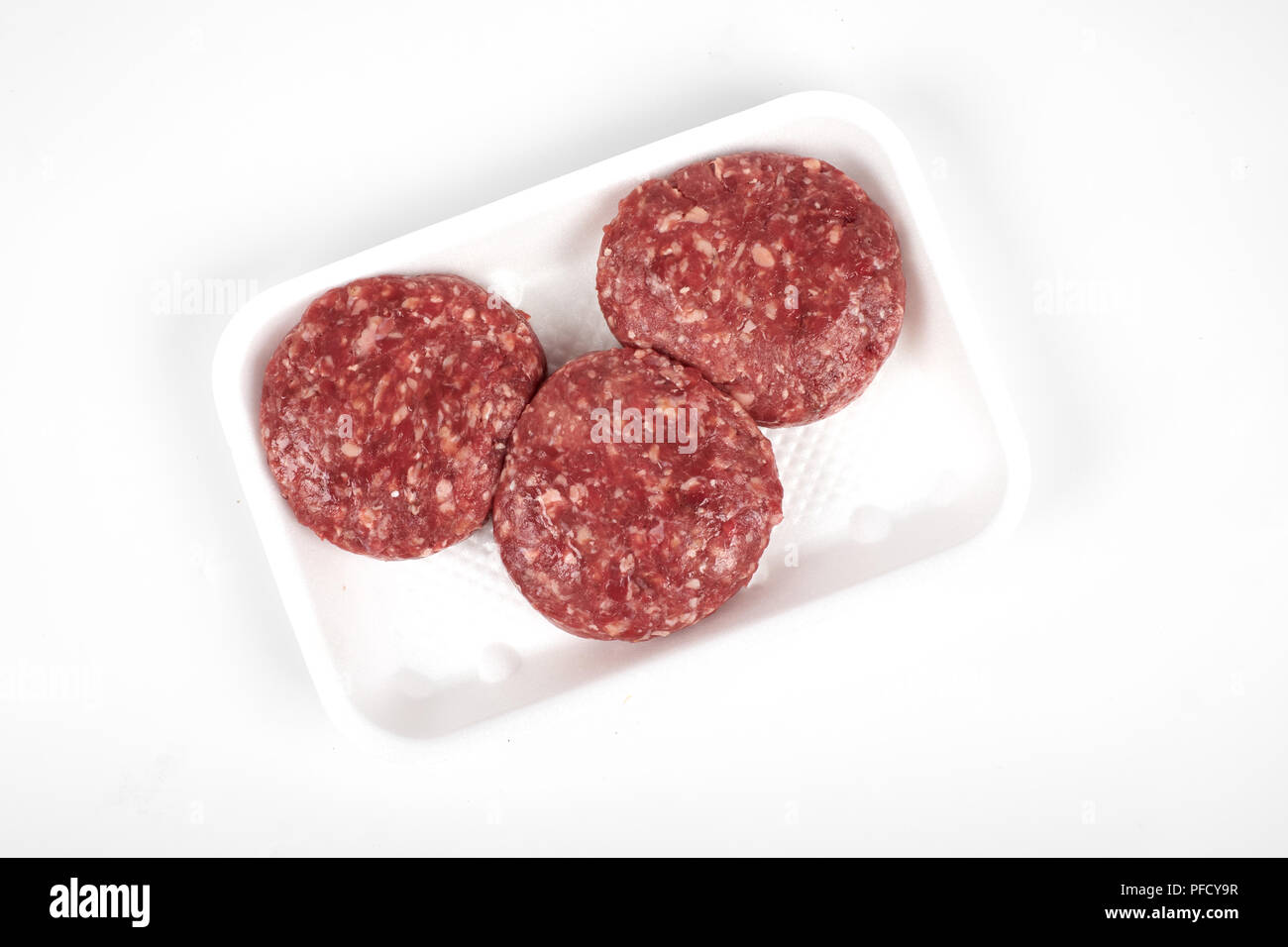 minced meat in plastic package isolated on white background Stock Photo