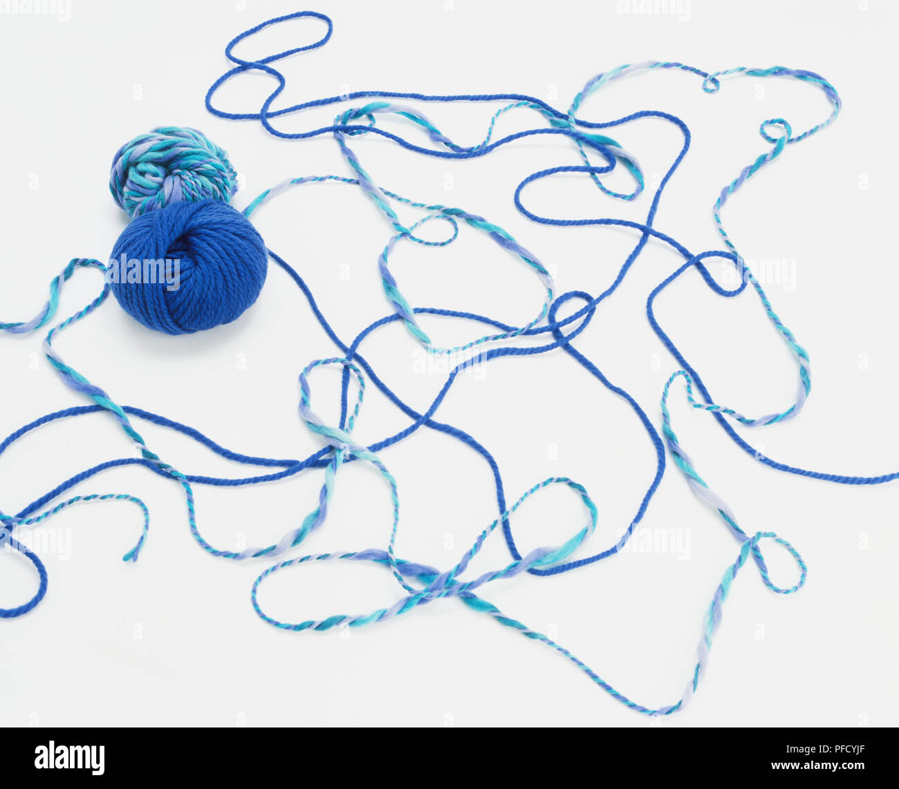 Two balls of wool partially unrolled Stock Photo Alamy