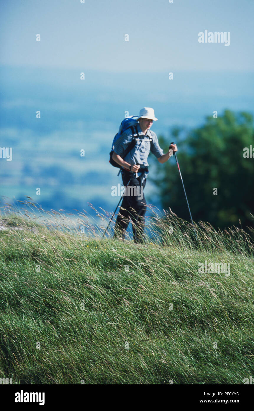 Man walking through field hi-res stock photography and images - Alamy
