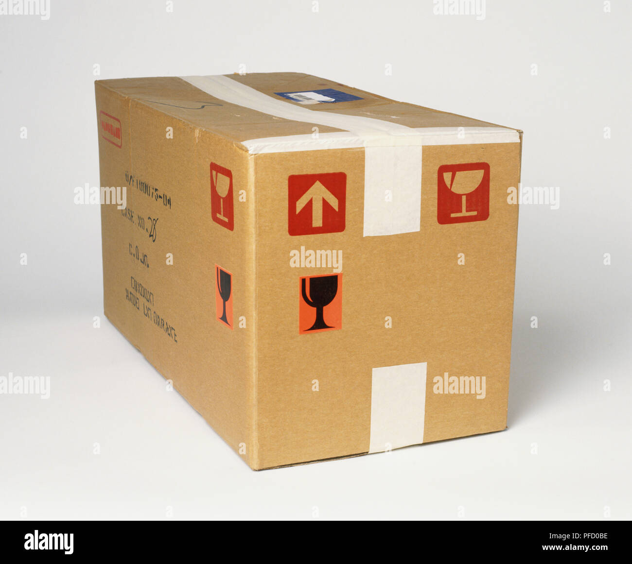 Cardboard box sealed with masking tape, front view Stock Photo Alamy