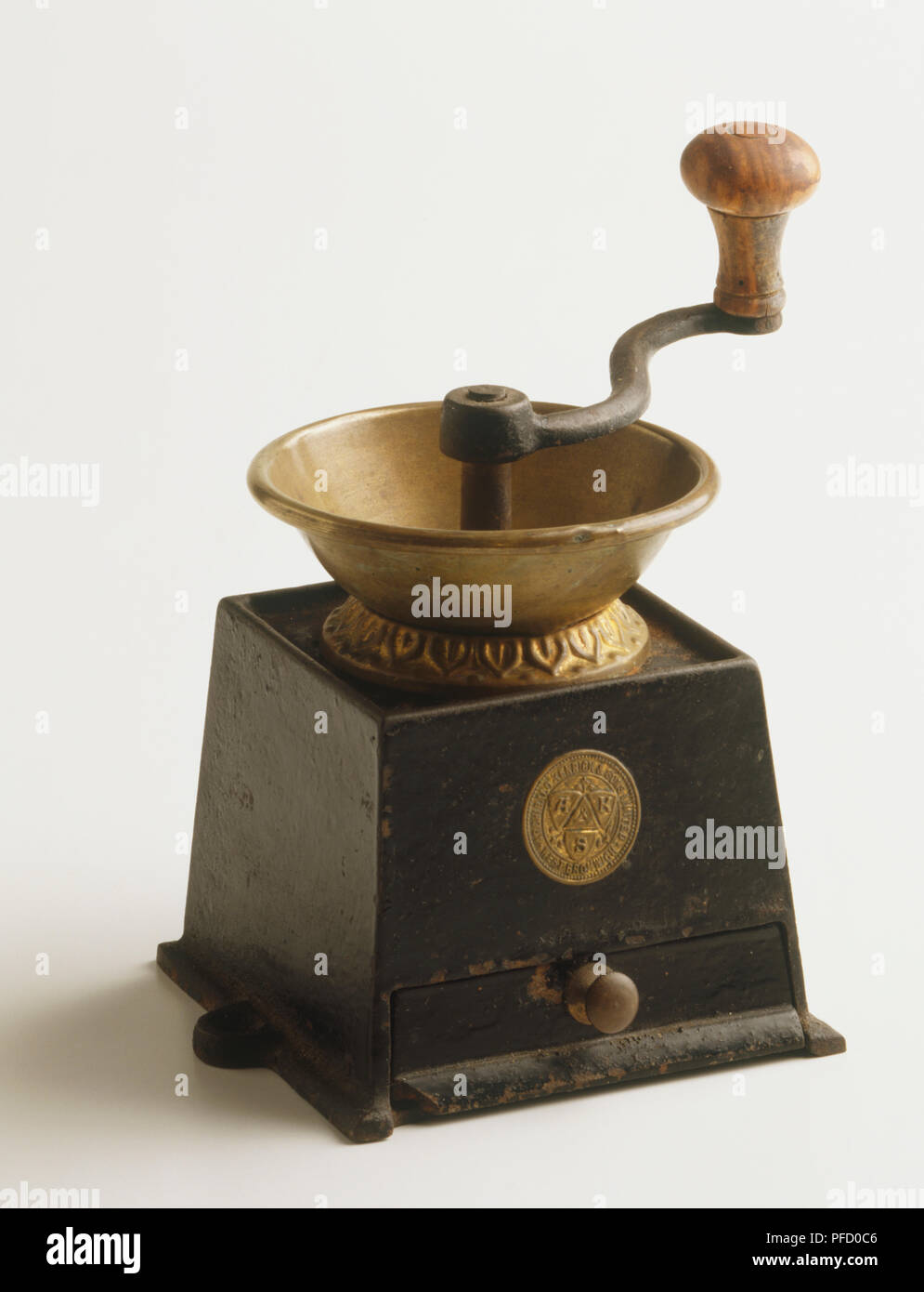 Old fashioned coffee bean grinder, side view. Stock Photo