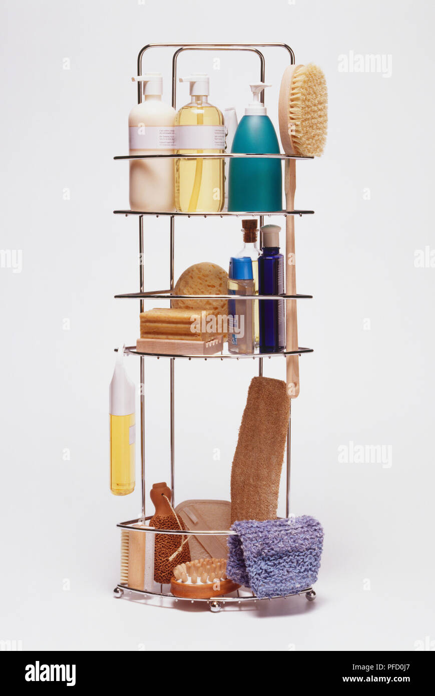 Metal shower rack containing assorted shampoos, shower gels and body