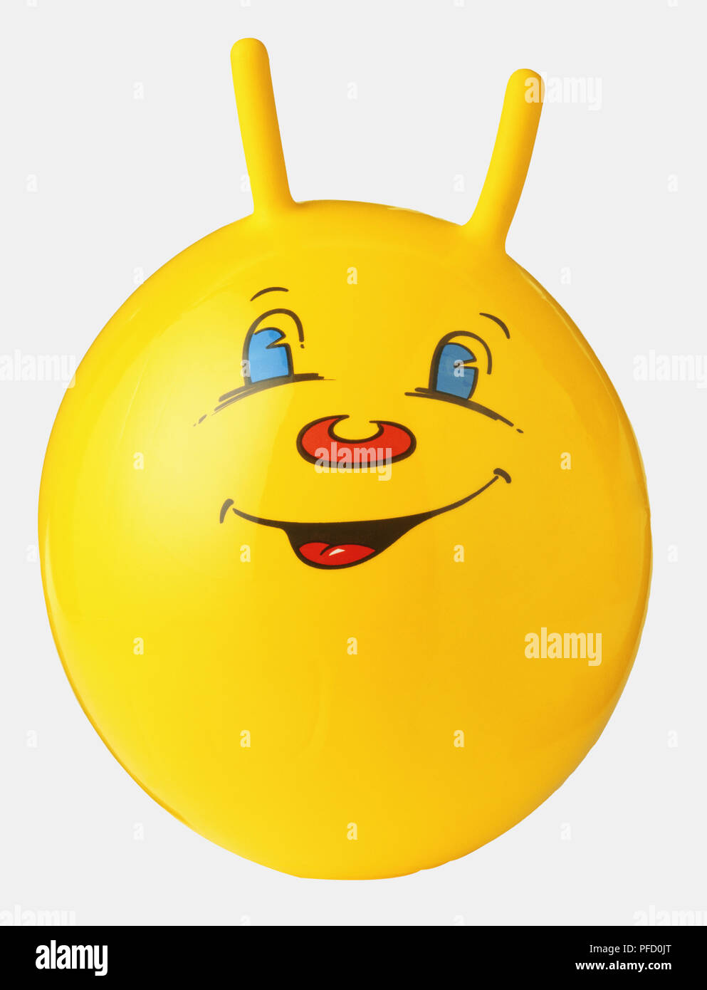 1950 space hopper, yellow with smiley face printed in front. Stock Photo