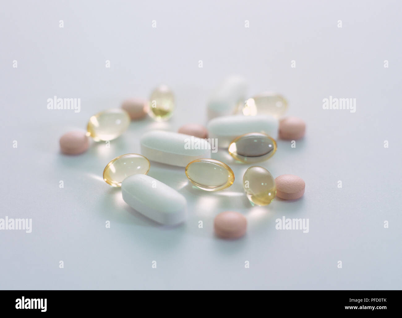 Selection of pastel coloured and translucent pills and capsules, different shapes and sizes Stock Photo