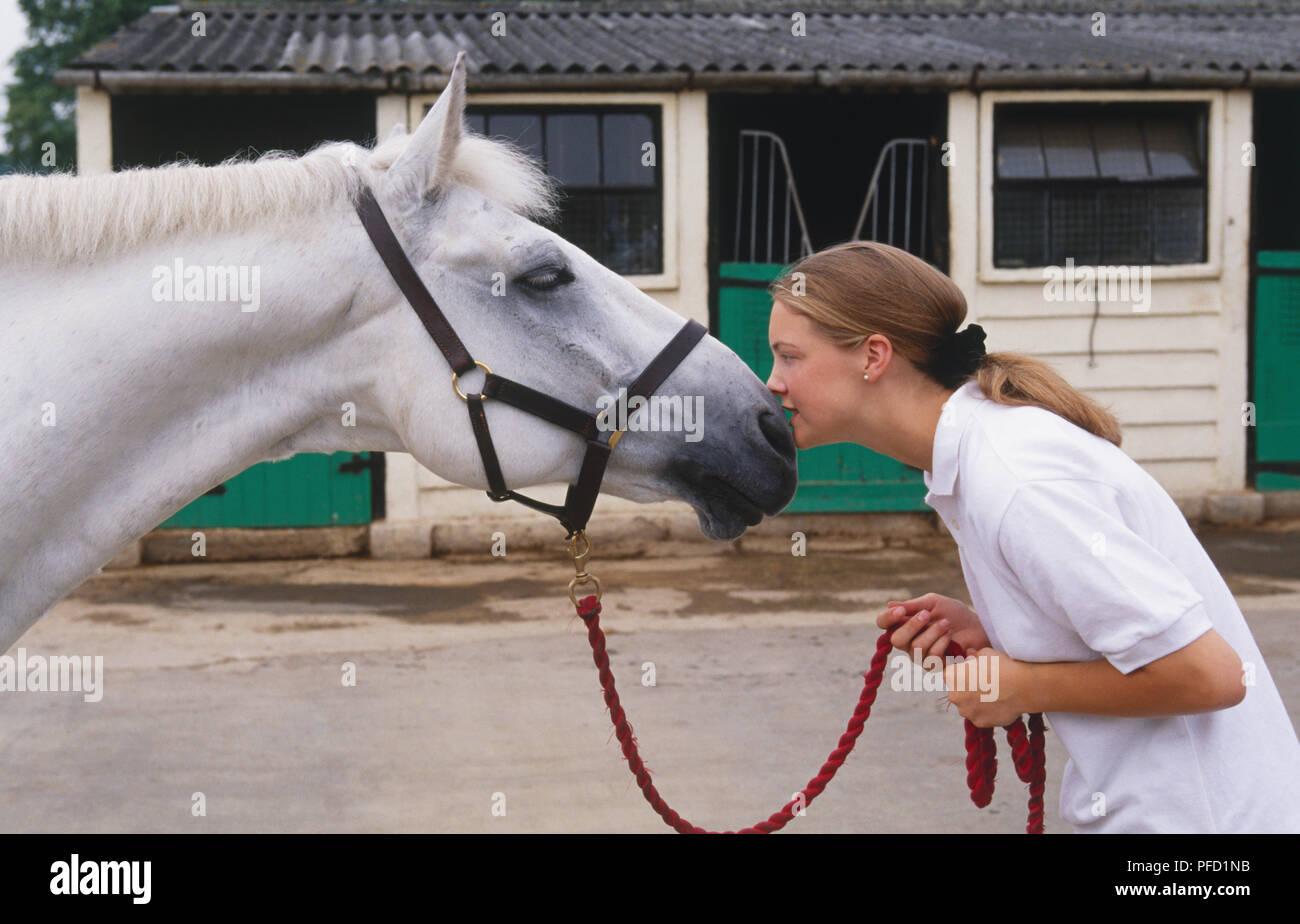 Girl With White Pony Stock Photo
