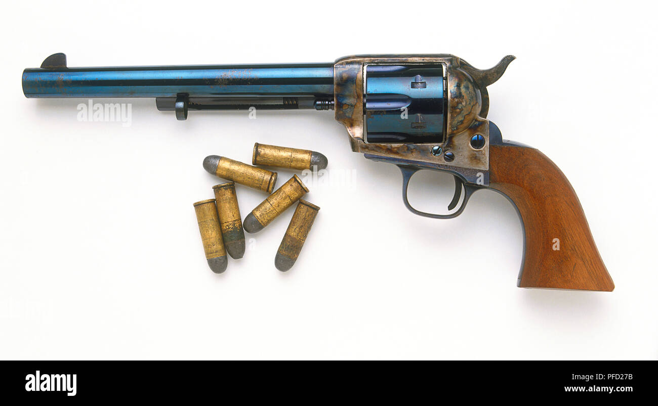 Colt Peacemaker and a handful of bullets Stock Photo