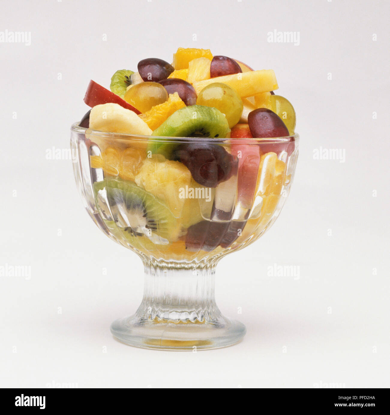 Fruit salad served in glass bowl, close up Stock Photo Alamy