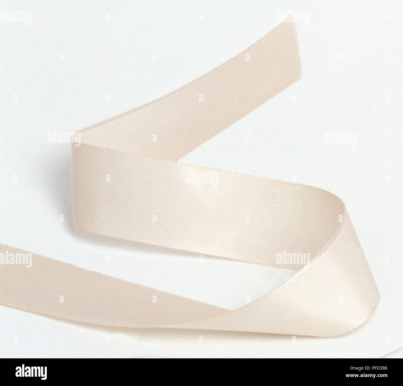 Length of cream ribbon. Stock Photo