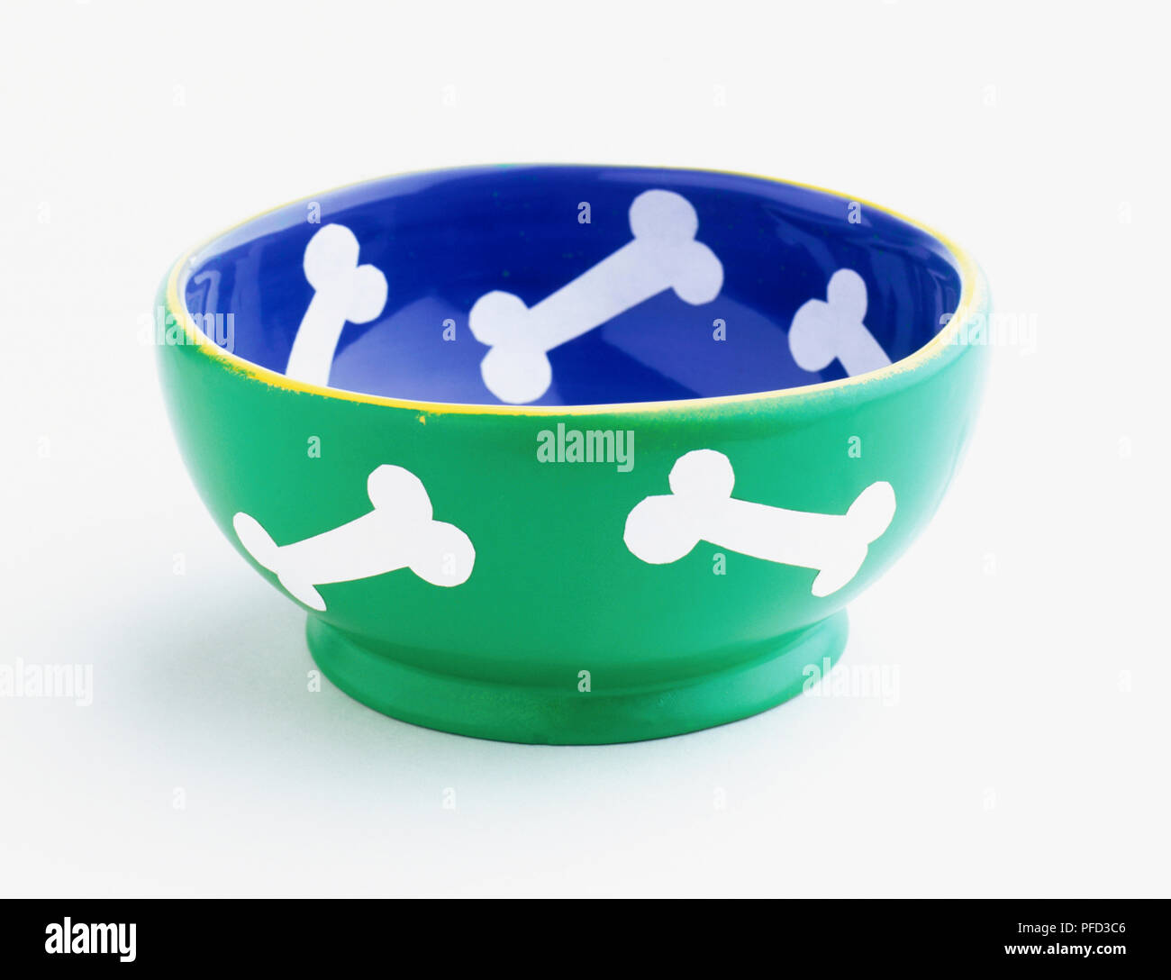 Green and blue bowl with bone design Stock Photo