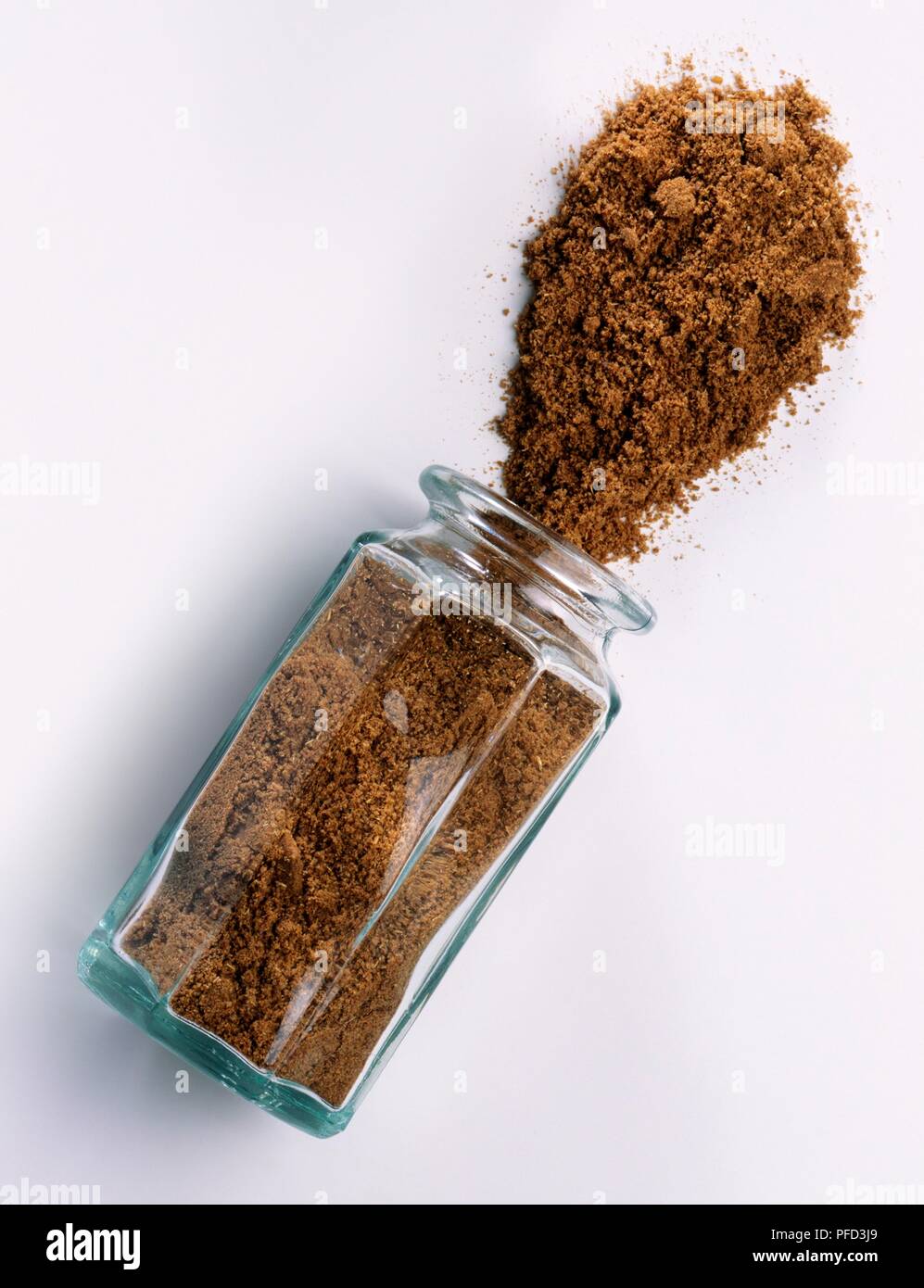 Ground ajowan spilling out of glass jar, closeup Stock Photo Alamy