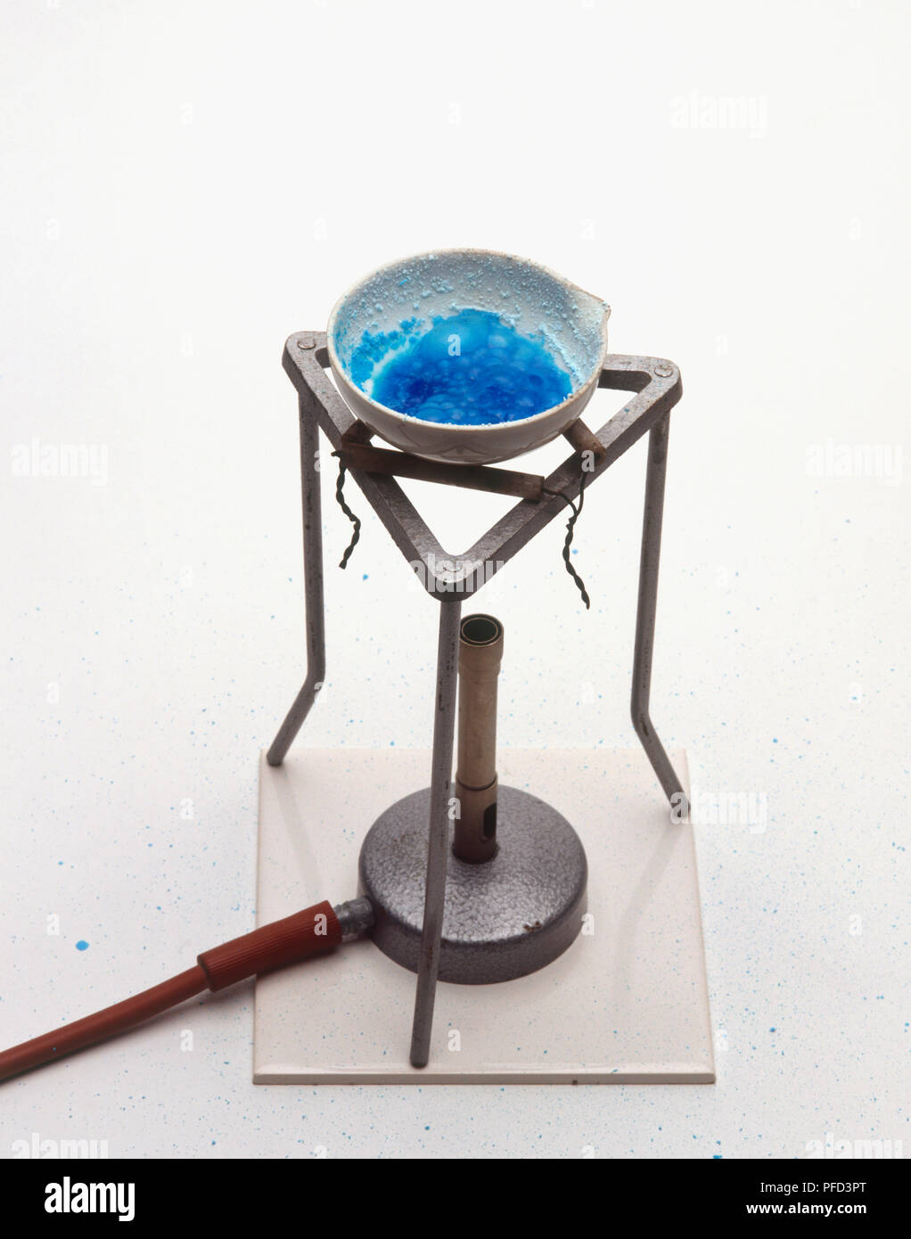 Copper sulphate in a dish being heated with bunsen burner Stock Photo Alamy