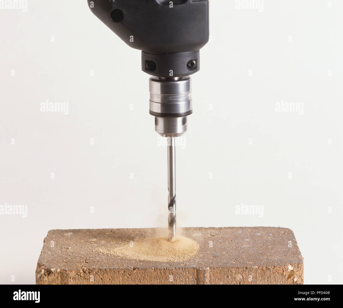 Drill cutting through hard material Stock Photo Alamy