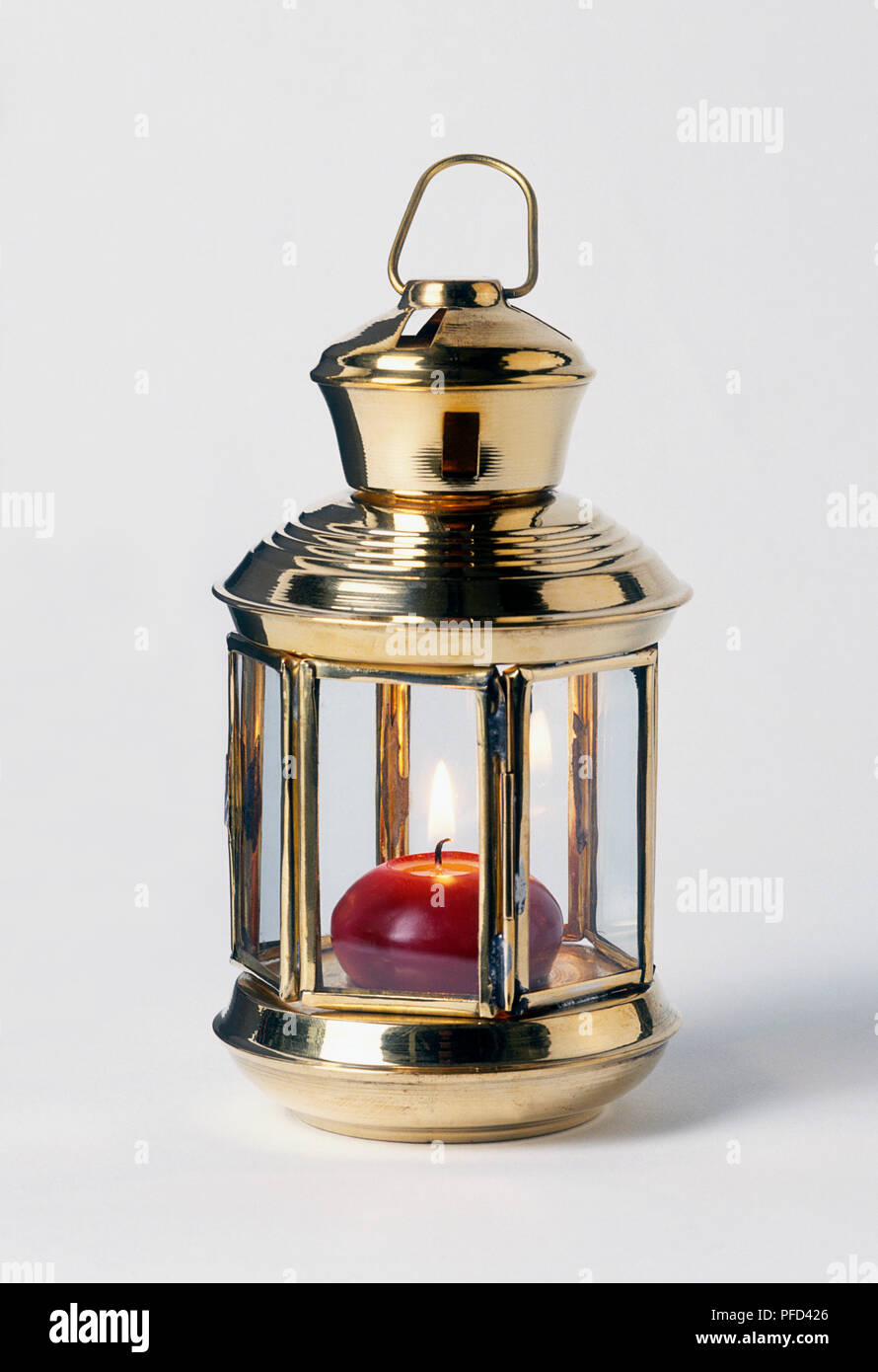 Brass lantern with lit candle inside Stock Photo Alamy