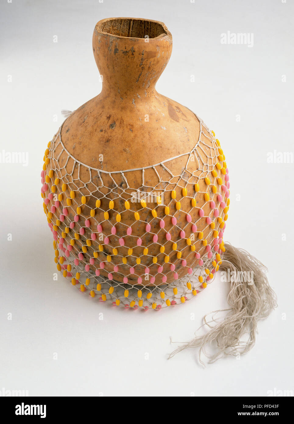 Saraka, African percussion instrument with net covering. Stock Photo