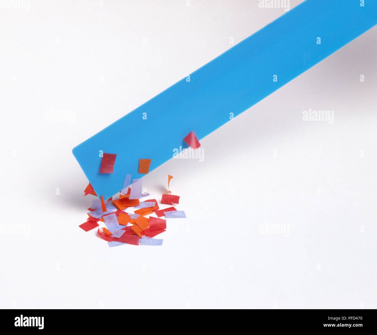 Pieces of paper picked up by electrically charged ruler (static