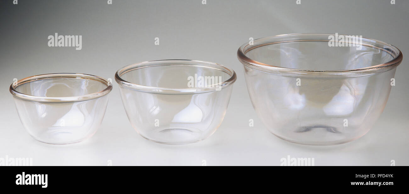 Three different sized glass mixing bowls. Stock Photo