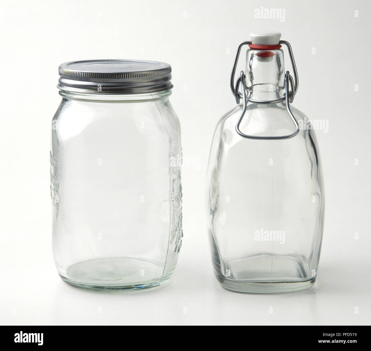 Two glass containers, one with a screw top and the other with a flip