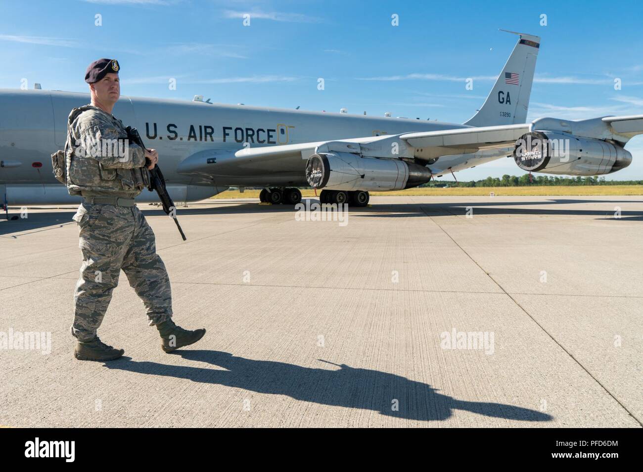 U.S. Air Force Tech. Sgt. Kyle Crook, a security forces specialist with the 78th Air Base Wing (ABW), Robins Air Force Base, Georgia, walks a perimeter in front on a E-8C Joint STARS at Fighter Wing Skrydstrup, Denmark, June 8, 2018. The 78th ABW provided security for the E-8C Joint STARS during their deployment to Denmark. The JSTARS team consists of the Georgia Air National Guard’s 116th ACW, plus active duty personnel assigned to the 461st ACW and Army JSTARS. They are in Denmark to participate in Exercise Baltic Operations, or BALTOPS, June 4-15 and Saber Strike 18 from June 3-15. JSTARS b Stock Photo