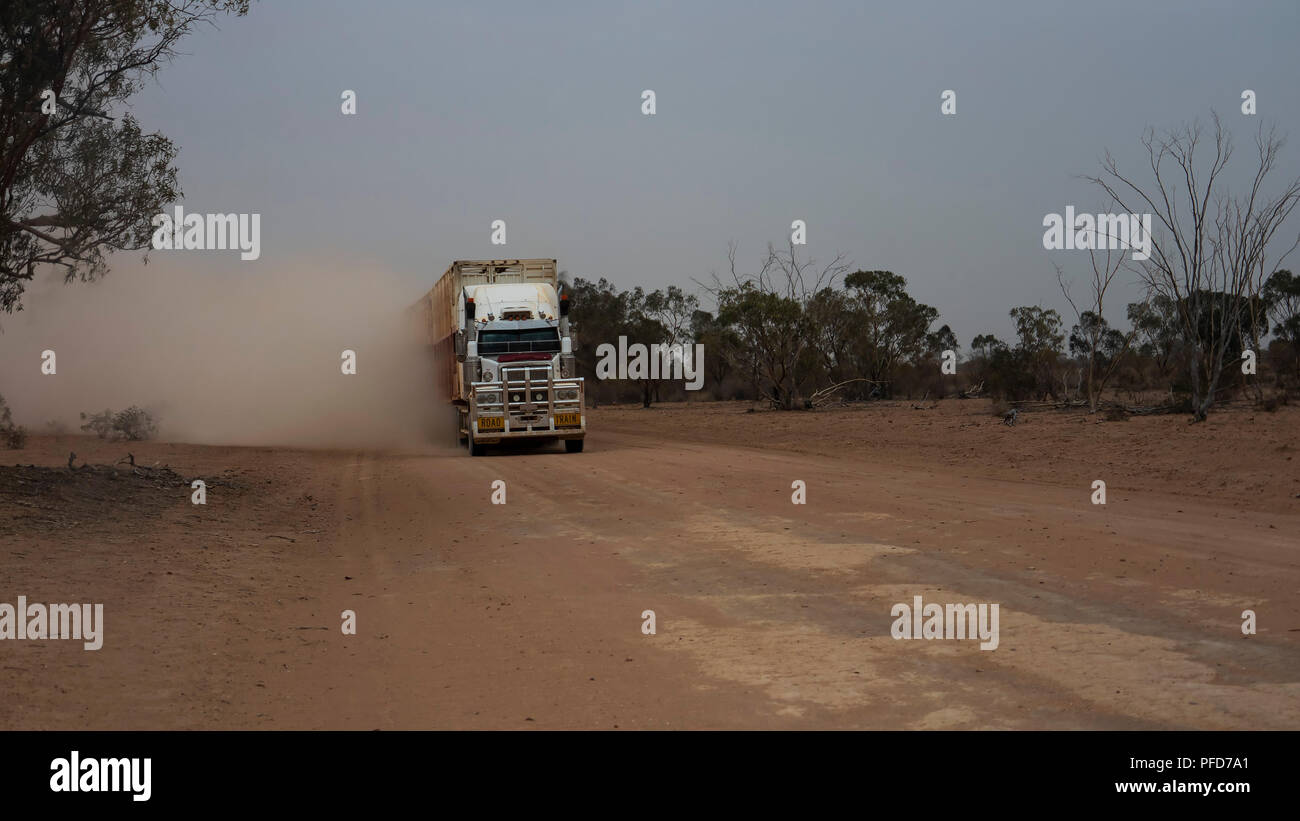Bulloo Downs, Queensland, Australia - August 03 2018: With an oncoming Road Train in outback Australia the prudent action is to pull over to the side. Stock Photo
