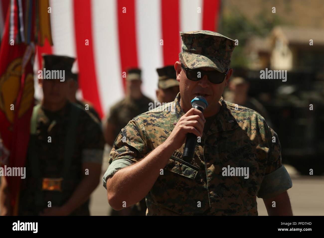 U.S. Marine Corps Chief Warrant Officer 5 David C. Thomas, with Fire and Maneuver Intergration Division, Headquarters Marine Corps, delievers a speech during a retirement ceremony at Marine Corps Base Camp Pendleton, Calif., June 7, 2018. The ceremony was held in honor of Thomas for his 30 years of meritorious service. Stock Photo