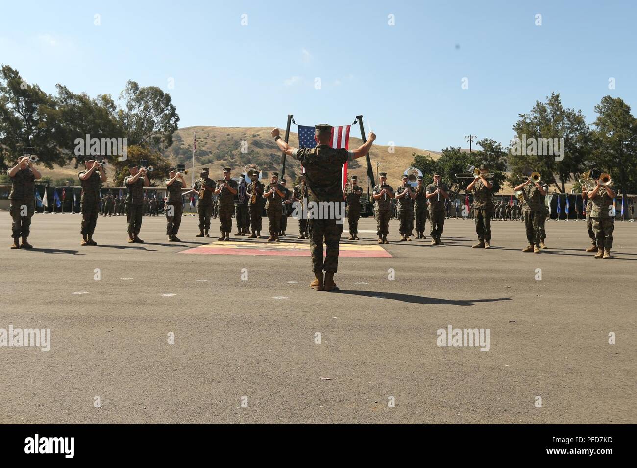 The U.S. Marine Band Camp Pendleton performs during a retirement ceremony at Marine Corps Base Camp Pendleton, Calif., June 7, 2018. The ceremony was held in honor of Chief Warrant Officer 5 David C. Thomas for his 30 years of meritorious service. Stock Photo