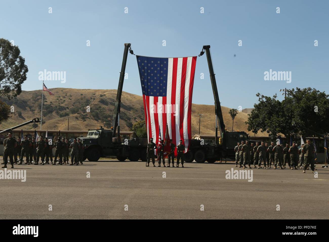 U.S. Marines with 11th Marine Regiment, 1st Marine Division, stand in formation during a retirement ceremony at Marine Corps Base Camp Pendleton, Calif., June 7, 2018. The ceremony was held in honor of Chief Warrant Officer 5 David C. Thomas for his 30 years of meritorious service. Stock Photo