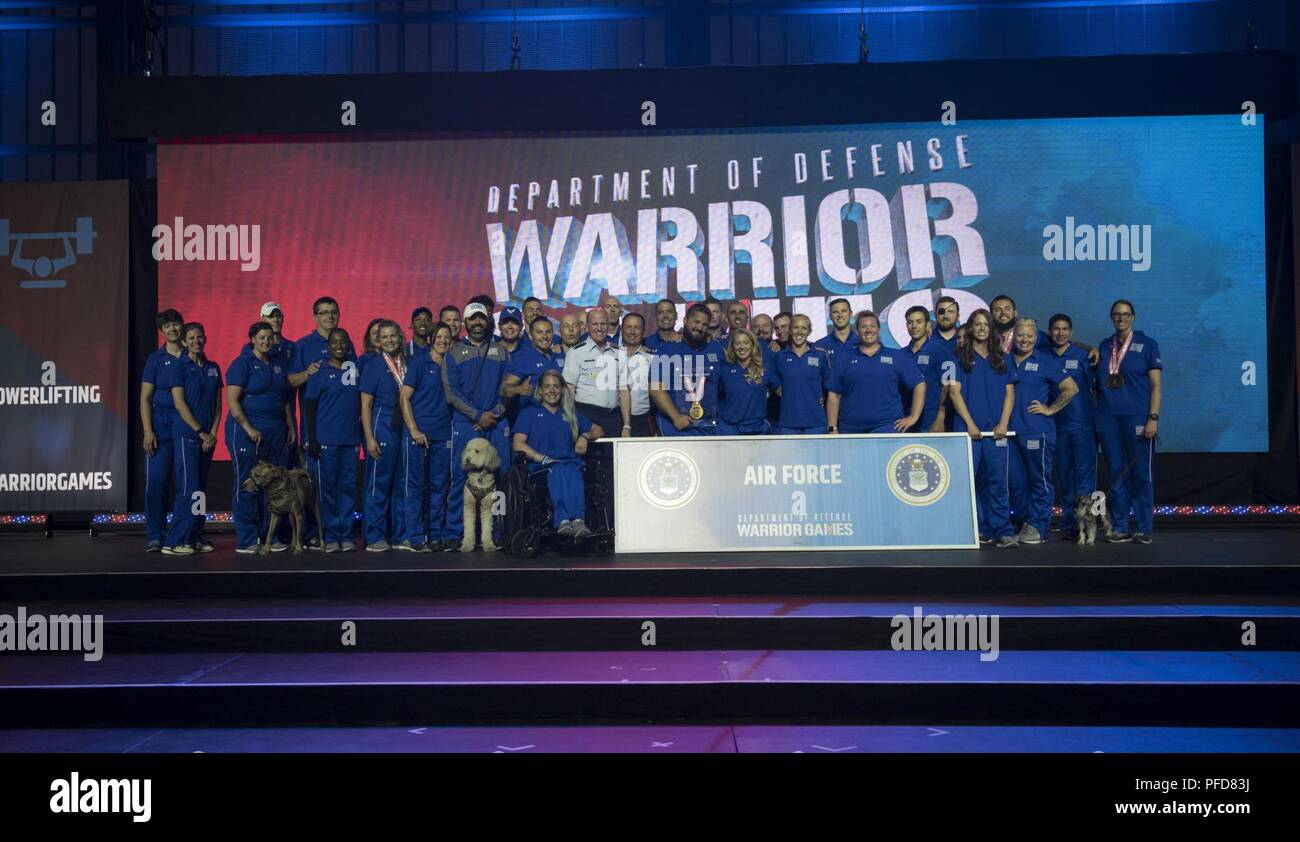 Team Air Force celebrates on stage at the closing ceremony of the Department of Defense Warrior Games in Colorado Springs, Colorado, June 9, 2018. The Games will be held in Tampa, Florida, at the Special Operations Command headquarters, in 2019. Stock Photo