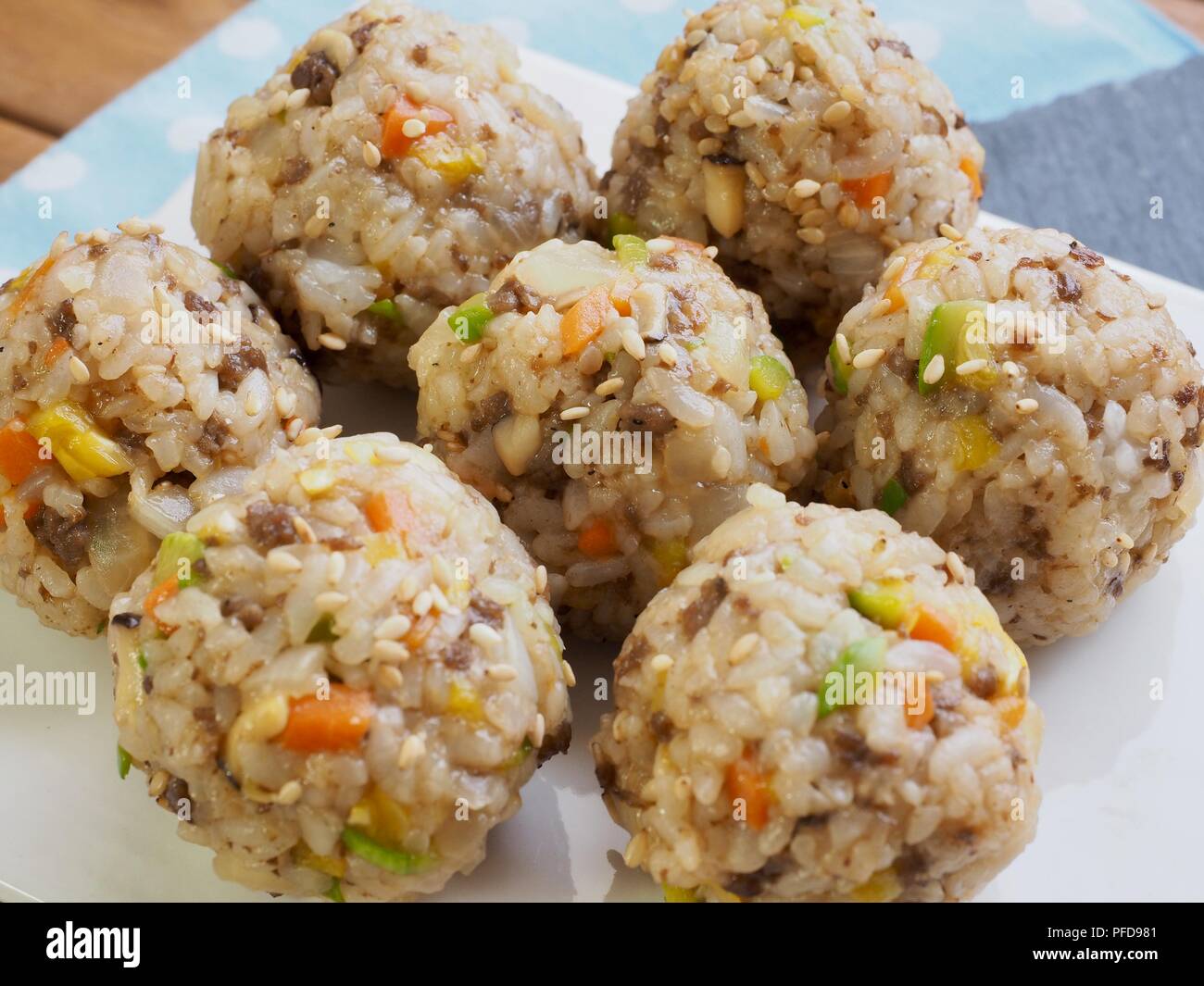 Asian food  beef and vegetables rice balls and pickled radish Stock Photo