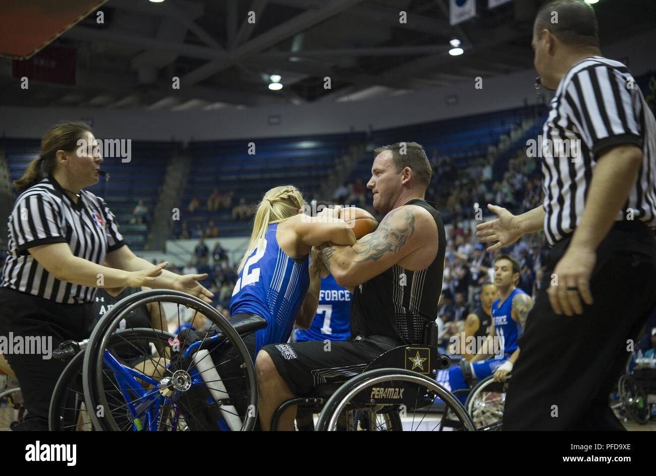 Team Army Member Staff Sgt Ross Alewine In Black Tries To Pull