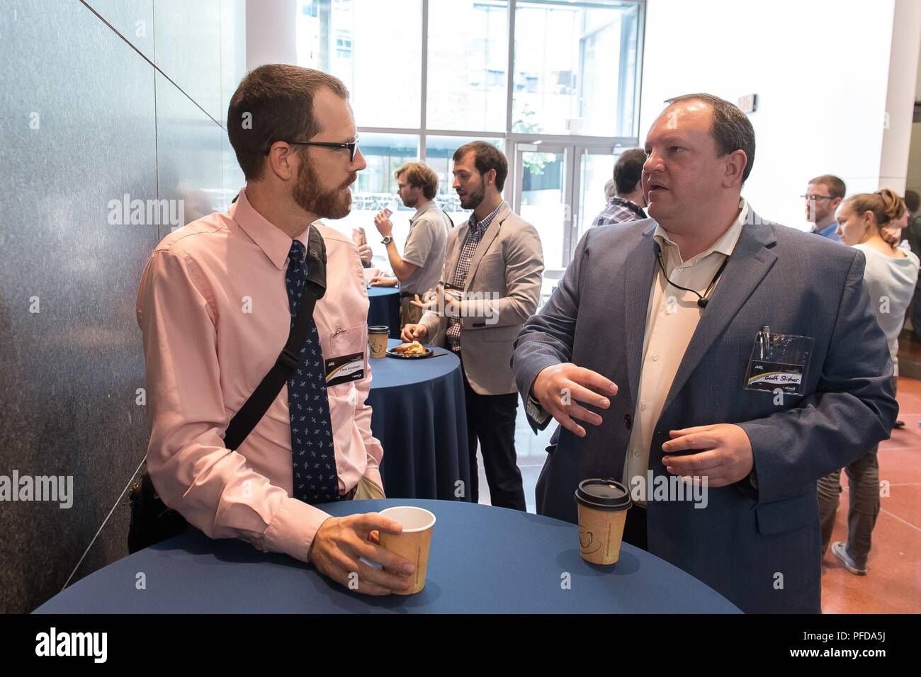 Geoff Slipher (right), the U.S. Army Research Laboratory’s Autonomous Systems Division chief speaks with Army researcher Chris Kroninger June 6, 2018, at the Robotics Collaborative Technology Alliance review at the University of Pennsylvania. Stock Photo