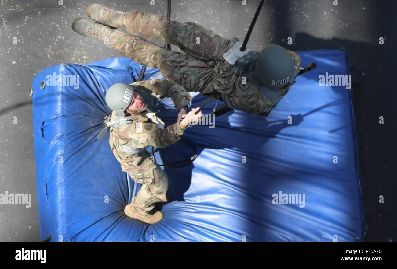 A Soldier rappels from a 70-foot tower during the final phase of Air ...