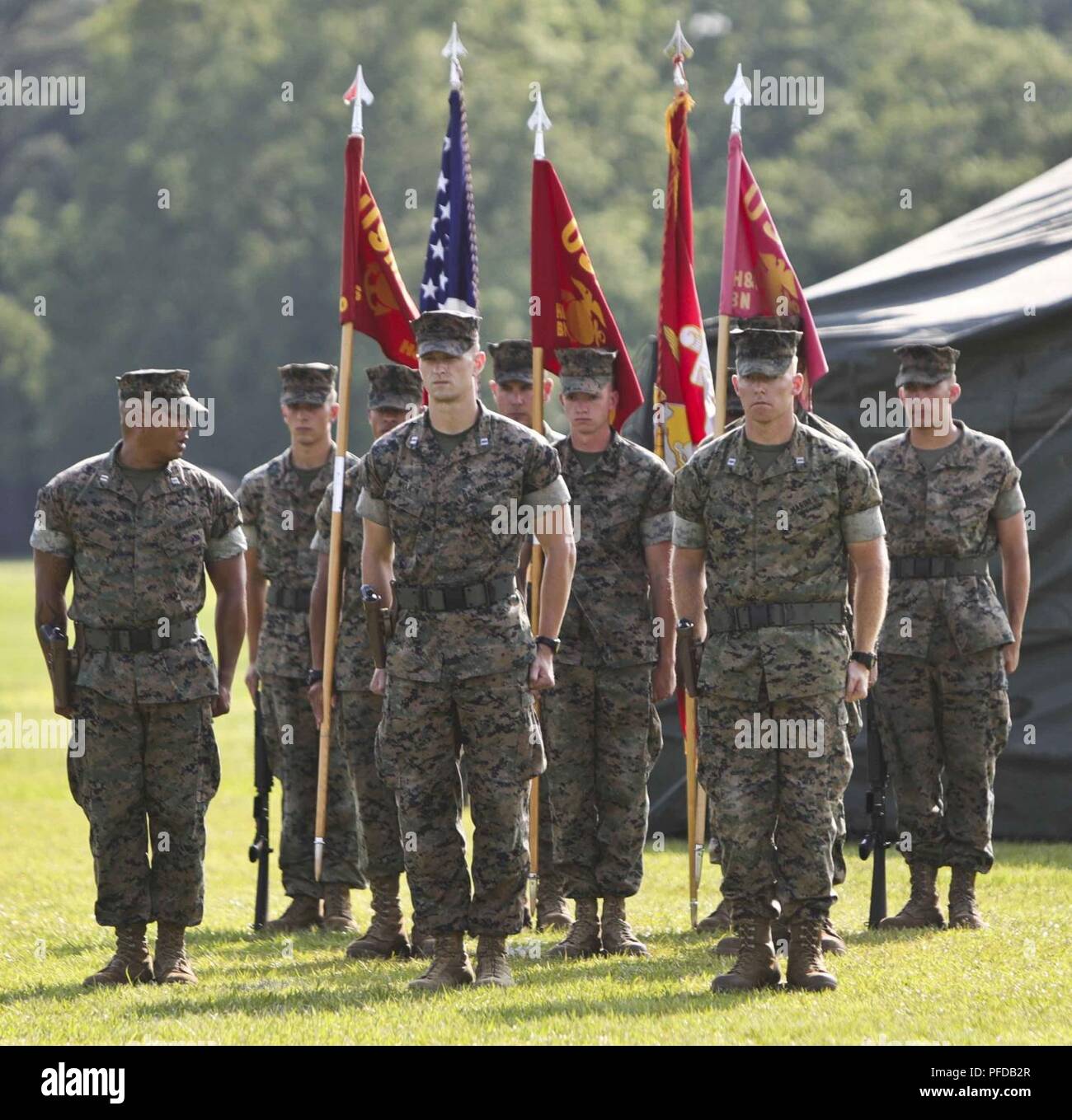 U.S. Marines assigned to Headquarters and Service (H&S) Battalion, School of Infantry-East, prepare to march during the H&S Battalion change of command ceremony at Camp Lejeune, N.C., June 8, 2018.  The change of command ceremony represents the offical passing of authority from the offgoing commander, Lt.Col. Kyle G. Phillips to the oncoming, Lt. Col. Amy E. Punzel. Stock Photo
