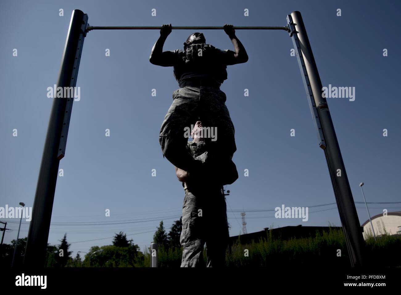 Senior Airman Antonio Gant, 374th Security Forces Squadron 2018 Security  Forces Advanced Combat Skills Assessment team member, does pull ups in  bullet proof vest during group physical training, June 1, 2018, at