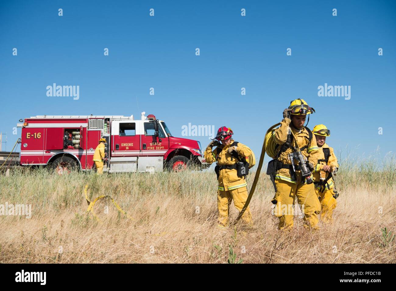 9th Civil Engineer Squadron firefighters prepare to fight a mock wildfire during a training exercise at Beale Air Force Base, California June 8, 2018. Beale firefighters are responsible for protecting over 23,000 acres of property as well as supporting the surrounding local municipalities. Stock Photo