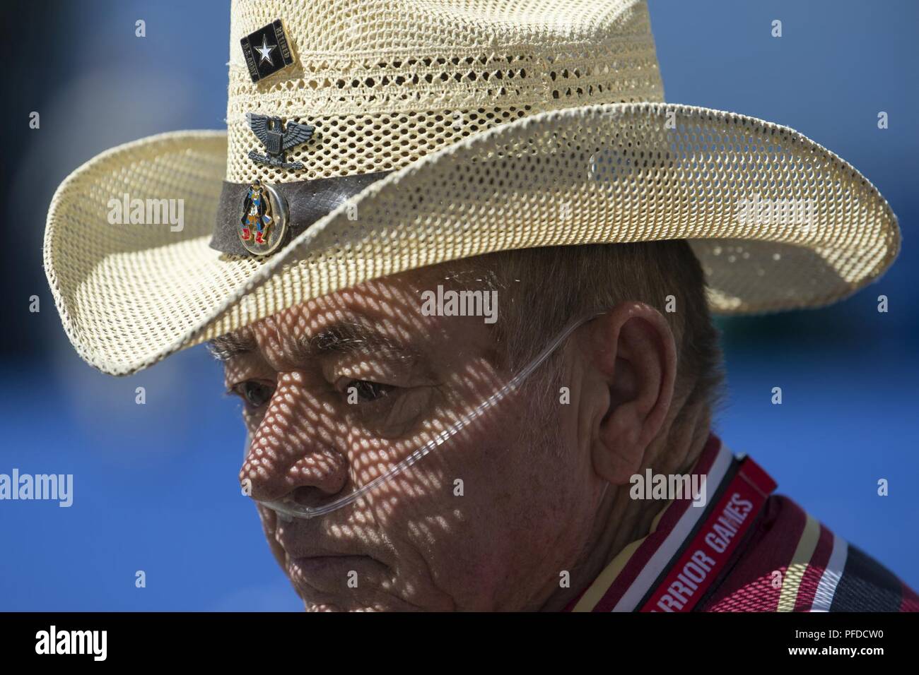 A cowboy hat creates speckled shadows on former Defense Dept. employee and  retired Army Sgt. 1st Class Walderman Hass as he attends the 2018 DoD  Warrior Games at the Air Force Academy