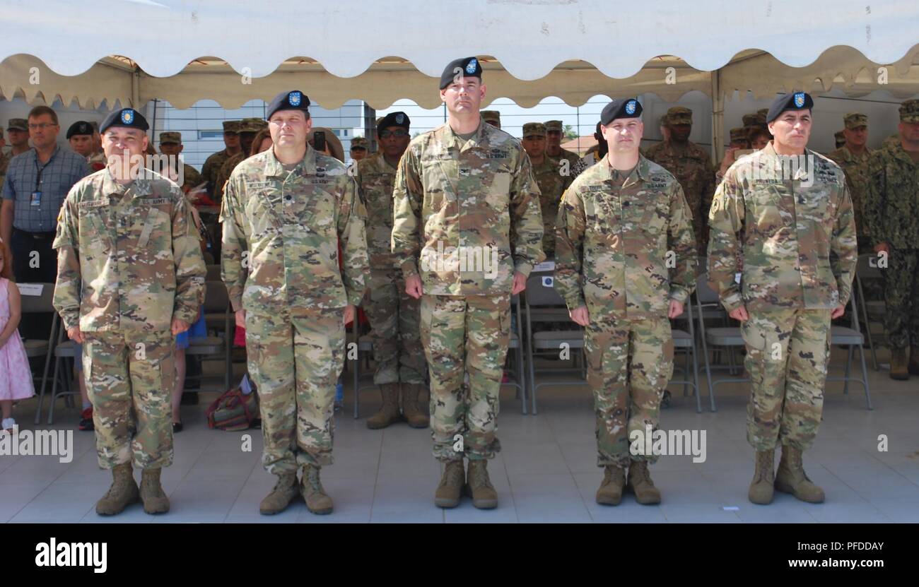 From left to right, Command Sgt. Maj. John Gutierrez outgoing senior enlisted leader, Lt. Col. John Misenheimer, outgoing commander, Col. Jason Riley, U.S. Army NATO Brigade commander, Lt. Col Keith Toler, incoming commander, and Command Sgt. Maj. Serjio Pruneda, incoming senior enlisted leader, prepare to execute the passing of the colors during the Allied Forces South Battalion’s change of command and responsibility ceremony, in which the battalion marked the change between both commanders and senior enlisted leaders. ( Stock Photo