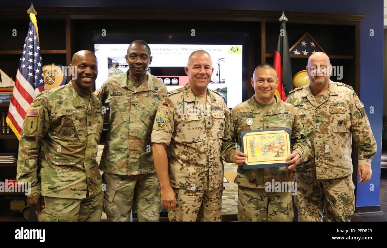 Staff Sgt. Marvin E. Palacios, U.S. Army Quartermaster School Petroleum and Water Department instructor, was awarded the German Armed Forces Proficiency Badge (Silver) by German Army liaisons to CASCOM, Lt. Col. Stephan Euler and Sgt. Maj. Ronald Schiller, in a ceremony June 5, 2018, at the Littlejohn Auditorium on Fort Lee, Va. The decoration of the Bundeswehr, the Armed Forces of the Federal Republic of Germany, is given to German Soldiers and Allied Soldiers who meet the rigorous qualifications. The badge is one of the few approved foreign awards that can be worn on U.S. military uniforms.  Stock Photo