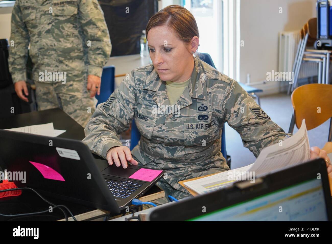 U.S. Air Force Tech. Sgt. Erin Wilkins, a squadron aviation resource manager with the 128th Airborne Command and Control Squadron, 116th Air Control Wing (ACW), logs data for the JSTARS team participating in BALTOPS and Saber Strike 18 exercises at Fighter Wing Skrydstrup, Denmark, June 5, 2018. The JSTARS team consists of the Georgia Air National Guard’s 116th ACW, plus active duty personnel assigned to the 461st ACW and Army JSTARS. They are in Denmark to participate in Exercise Baltic Operations, or BALTOPS, June 4-15 and Saber Strike 18 from June 3-15. JSTARS brings a unique, manned, joint Stock Photo