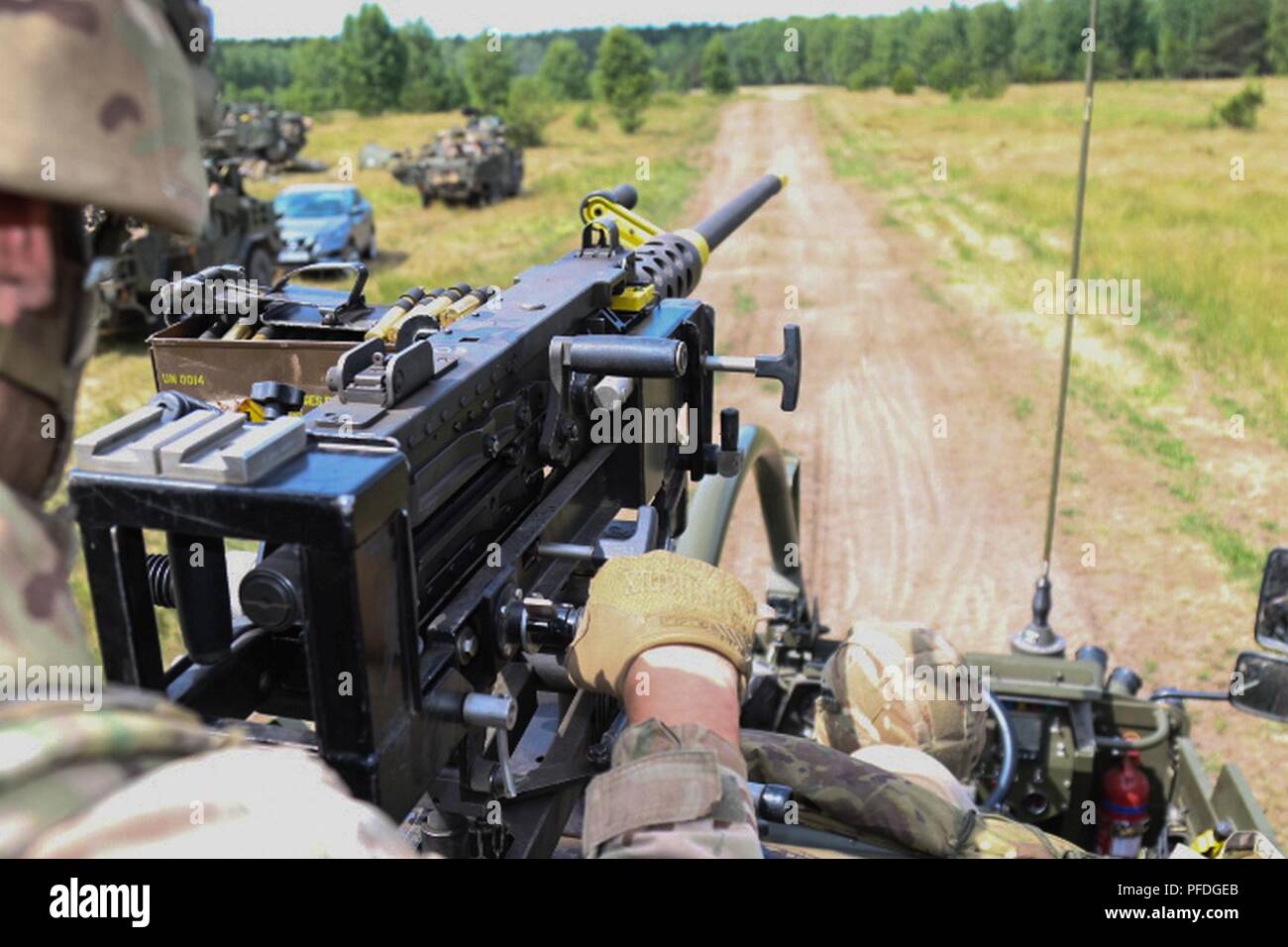 British Soldiers With Eagle Troop Battle Group Poland Use An M2 50 Caliber Machine Gun On Top Of A Mobility Weapon Mounted Installation Kit Jackal To Provide Security During A Multinational Exercise As