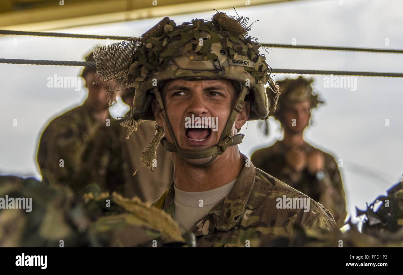A jumpmaster from the 173rd Airborne Brigade gives jump commands as ...