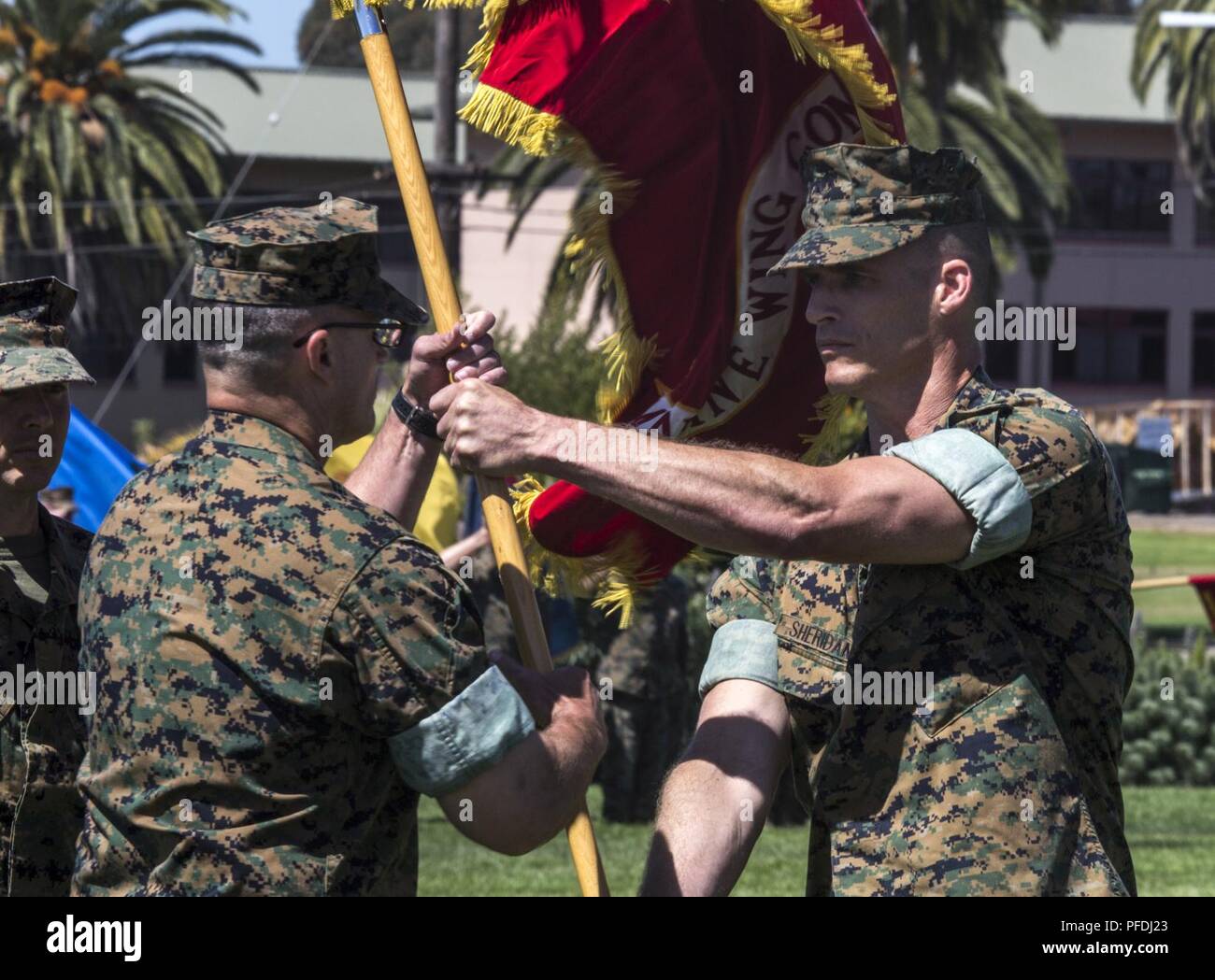 Lt. Col. Michael E. Sheridan former commanding officer of Marine Wing Communications Squadron (MWCS) 48, passes the command’s colors to Lt. Col. Brian C. Pate, commanding officer of MWCS-48, during their change of command ceremony at Marine Corps Air Station Miramar, Calif., June 13. Pate assumed command of MWCS-48 from Sheridan, who was in command for approximately two years and received a Meritorious Service Medal for his time with MWCS-48. Stock Photo