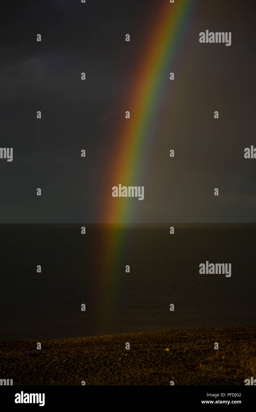 Rainbow over the beach at Colwyn Bay on the North Wales coast Stock Photo