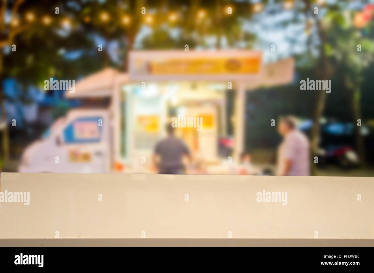 Wood Table Top And Abstract Blur Festival Food Truck Can Be Used
