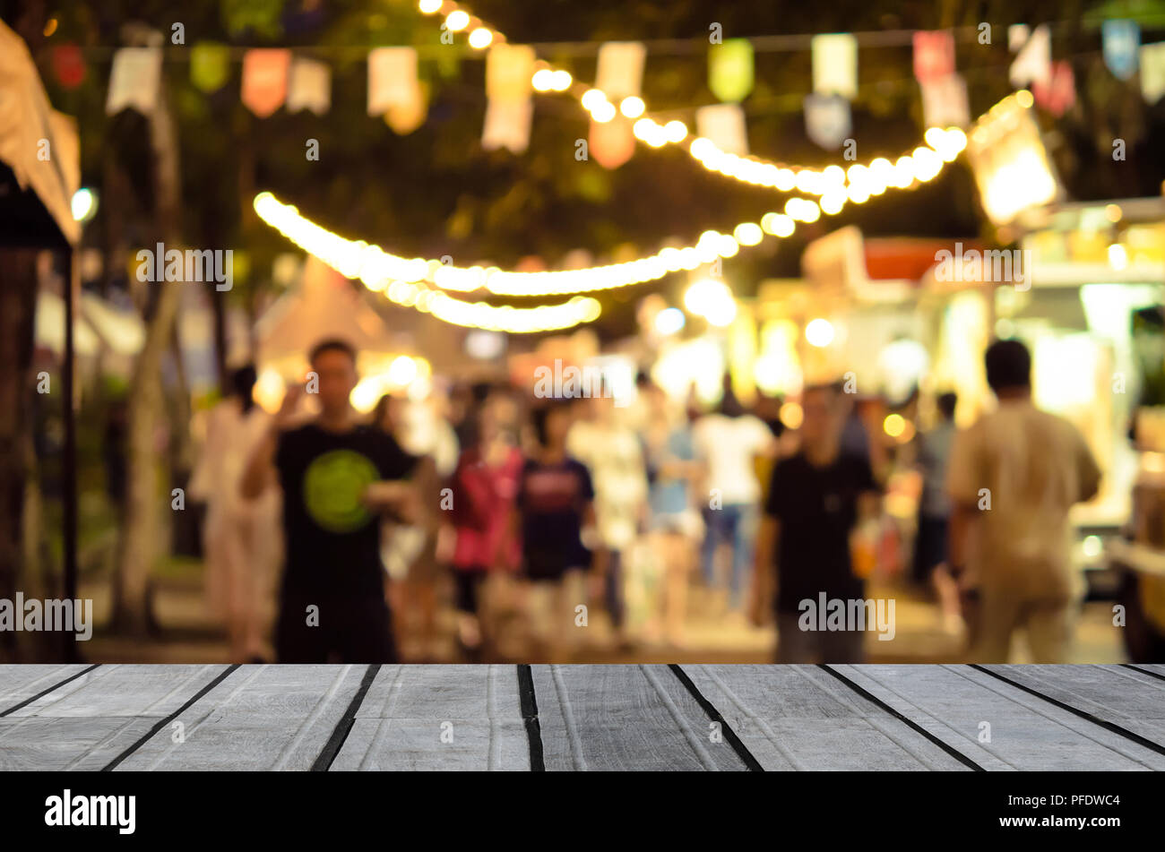 Wood Table Top And Abstract Blur Festival Food Truck Can Be Used