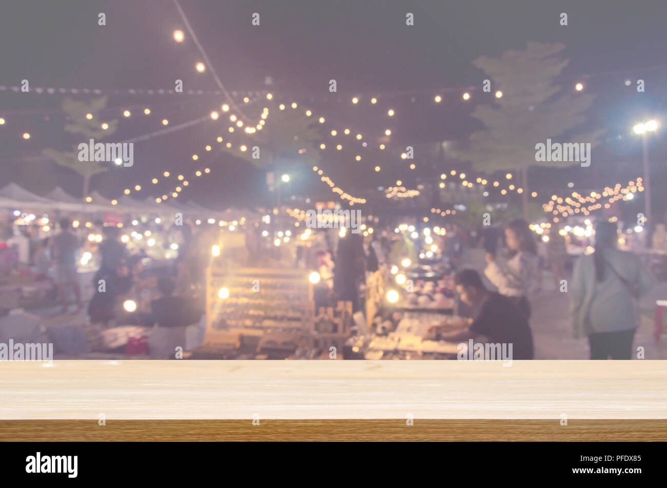 Wood Table Top And Abstract Blurred Festival Food Night Market