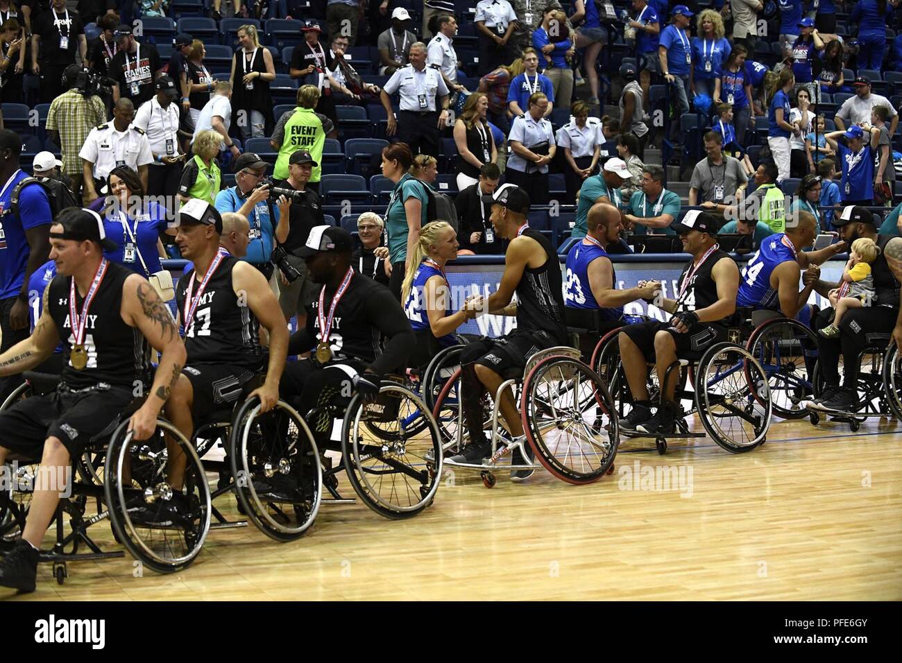 Team Air Force members shake hands with Team Army after the Department of  Defense Warrior Games wheelchair basketball championship at the U.S. Air  Force Academy, Colorado Springs, Colorado, June 9, 2018. Wheelchair