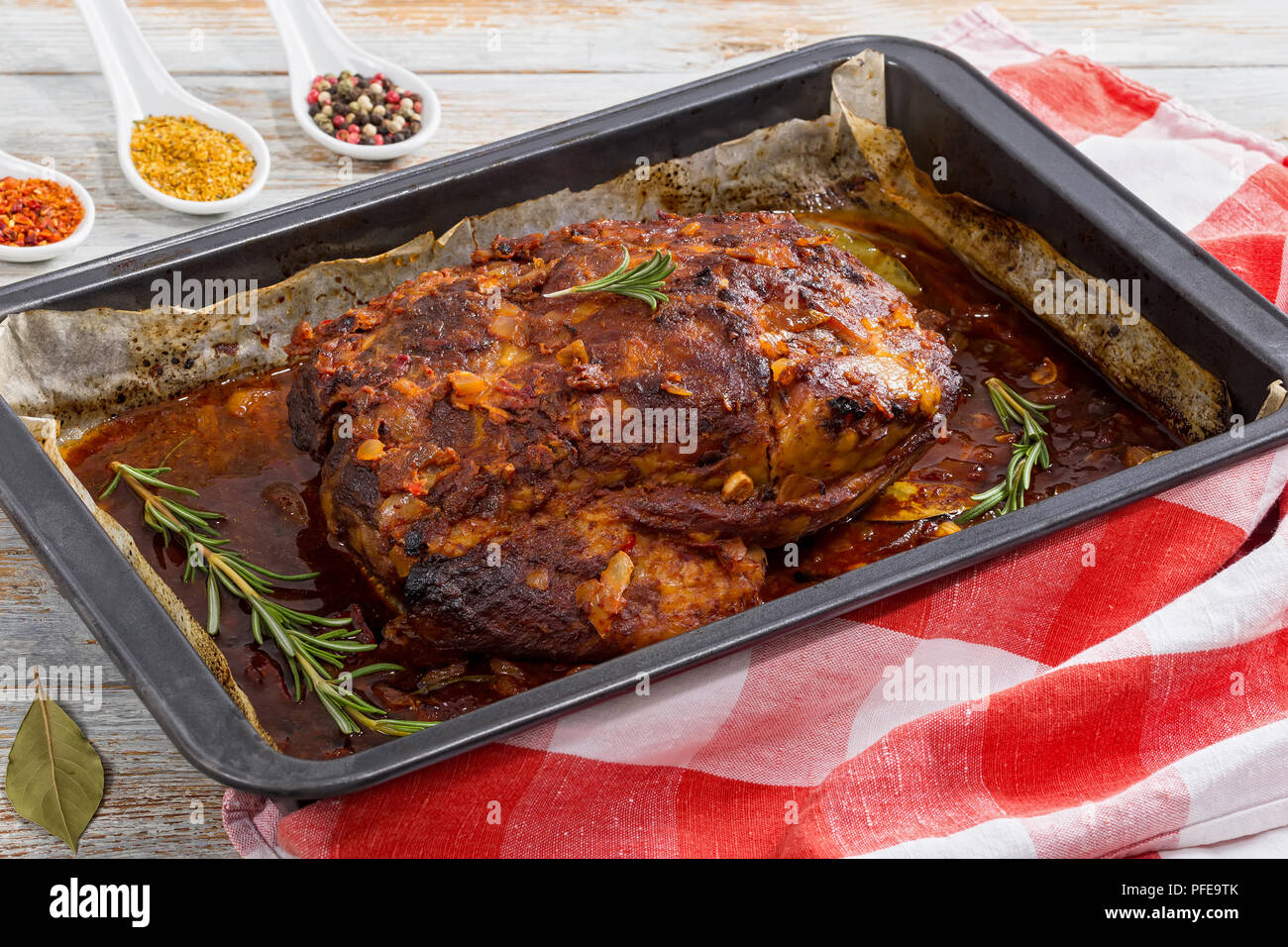 OvenBarbecued Pork shoulder grilled in roasting pan for festive family