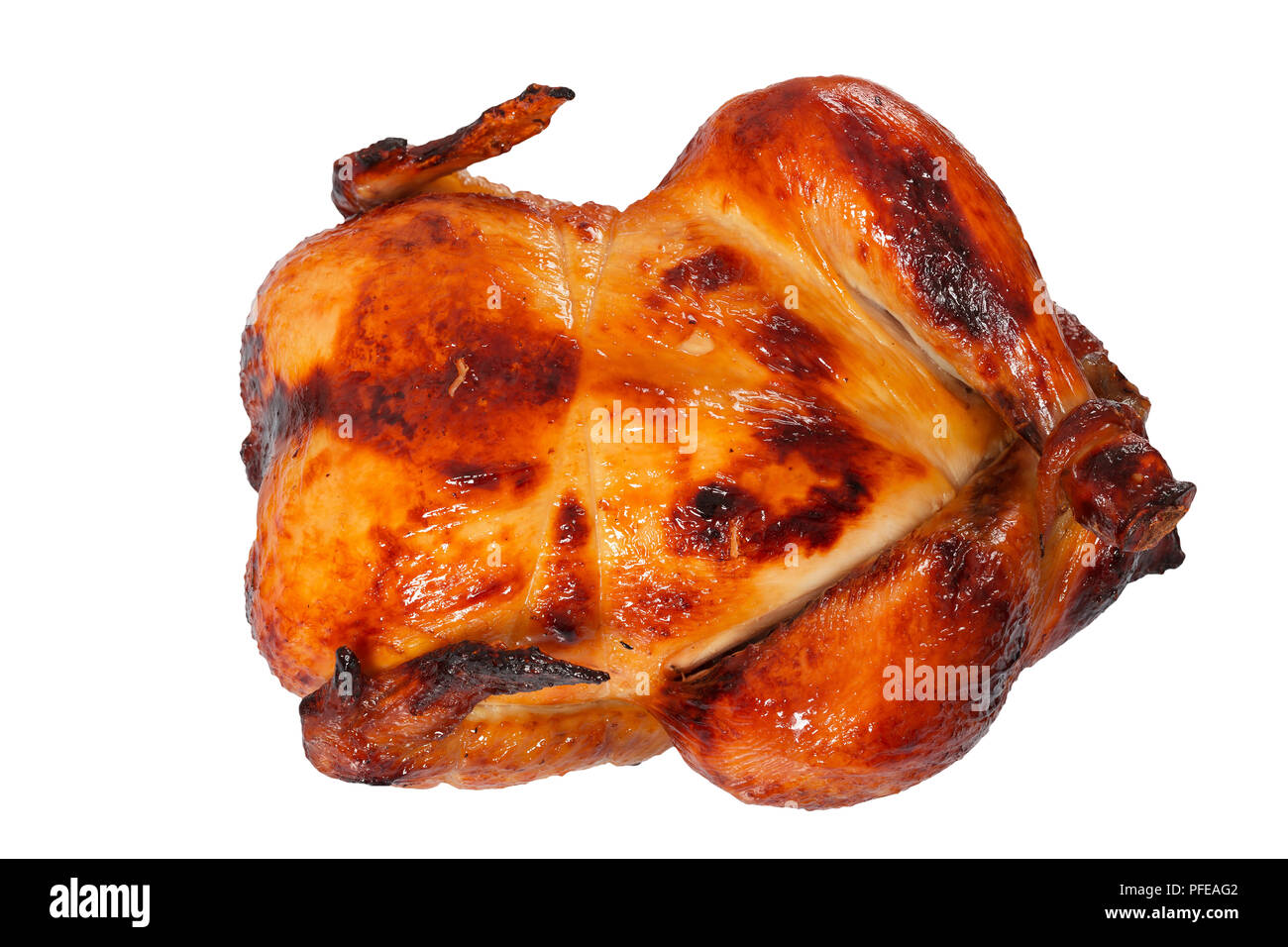 delicious golden crispy skin chicken grilled in oven isolated on white, view from above, close